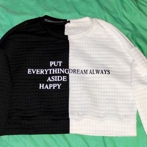 A split black and white cropped sweater brand is shein